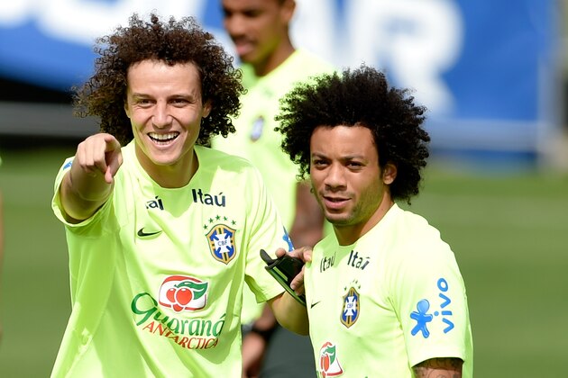 TERESOPOLIS, BRAZIL - JULY 07:  David Luiz gestures with Marcelo (R) during a training session of the Brazilian national football team at the squad's Granja Comary training complex, on July 07, 2014 in Teresopolis, 90 km from downtown Rio de Janeiro, Brazil.  (Photo by Buda Mendes/Getty Images)