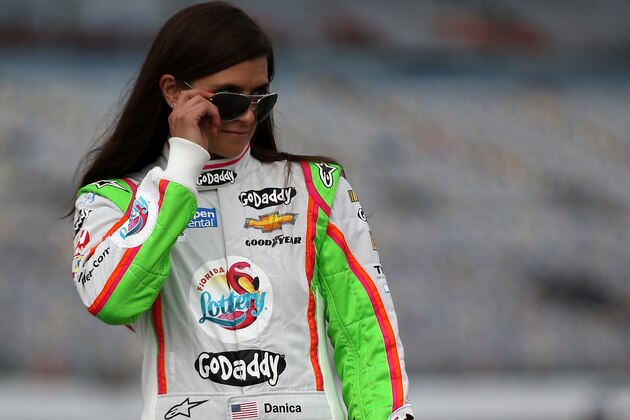 DAYTONA BEACH, FL - JULY 04:  Danica Patrick, driver of the #10 Florida Lottery/GoDaddy Chevrolet, walks on the grid during qualifying for the NASCAR Sprint Cup Series Coke Zero 400 at Daytona International Speedway on July 4, 2014 in Daytona Beach, Florida.  (Photo by Chris Graythen/Getty Images)