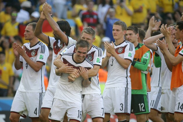 Germany's Philipp Lahm and Bastian Schweinsteiger celebrate after the World Cup quarterfinal soccer match between Germany and France at the Maracana Stadium in Rio de Janeiro, Brazil, Friday, July 4, 2014. Germany won the match 1-0. (AP Photo/David Vincent)
