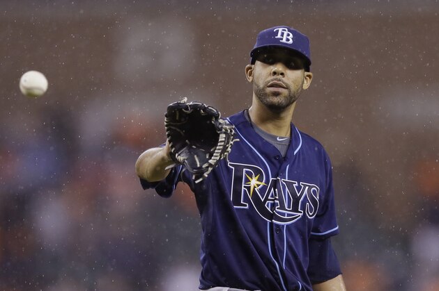 Tampa Bay Rays starting pitcher David Price waits on the throw from catcher Jose Molina during the ninth inning of a baseball game against the Detroit Tigers in Detroit, Sunday, July 6, 2014. (AP Photo/Carlos Osorio)