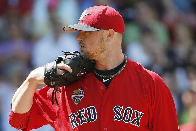 Boston Red Sox's Jon Lester pitches in the fifthinning of the first game of a baseball doubleheader against the Baltimore Orioles in Boston, Saturday, July 5, 2014. (AP Photo/Michael Dwyer)