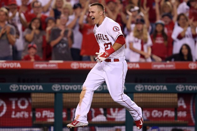 ANAHEIM, CA - JULY 04:  Mike Trout #27 of the Los Angeles Angels of Anaheim celebrates as he runs home after hitting a game winning walk off home run to lead off the ninth inning against the Houston Astros at Angel Stadium of Anaheim on July 4, 2014 in Anaheim, California. The Angels won 7-6.  (Photo by Stephen Dunn/Getty Images)