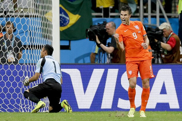 Netherlands' Robin van Persie celebrates after scoring in a penalty shoot out during the World Cup quarterfinal soccer match between the Netherlands and Costa Rica at the Arena Fonte Nova in Salvador, Brazil, Saturday, July 5, 2014. (AP Photo/Matt Dunham)