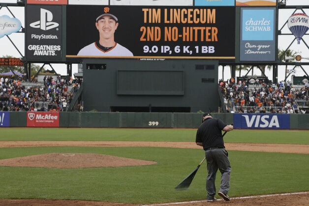 A groundskeeper sweeps the field after San Francisco Giants starting pitcher Tim Lincecum threw a no-hitter in their baseball game against the San Diego Padres Wednesday, June 25, 2014, in San Francisco. Lincecum threw his second career no-hitter. San Francisco won the game 4-0. (AP Photo/Eric Risberg)