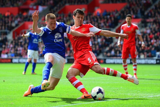 SOUTHAMPTON, ENGLAND - APRIL 26:  James McCarthy of Everton and Dejan Lovren of Southampton battle for the ball during the Barclays Premier League match between Southampton and Everton at St Mary's Stadium on April 26, 2014 in Southampton, England.  (Photo by Jamie McDonald/Getty Images)