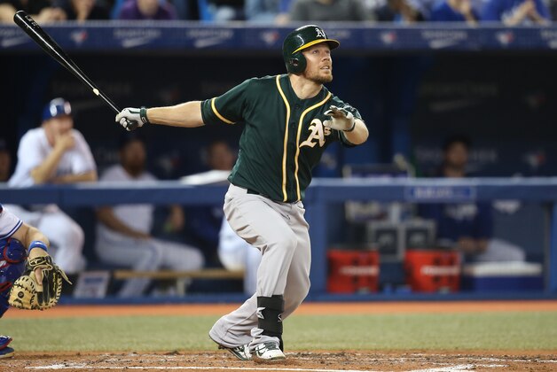TORONTO, CANADA - MAY 23: Brandon Moss #37 of the Oakland Athletics hits a solo home run in the fourth inning during MLB game action against the Toronto Blue Jays on May 23, 2014 at Rogers Centre in Toronto, Ontario, Canada. (Photo by Tom Szczerbowski/Getty Images)