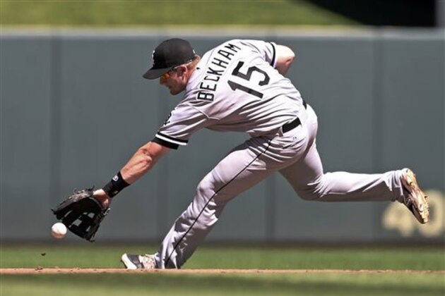 Chicago White Sox second baseman Gordon Beckham runs down a sharp grounder from Minnesota Twins' Brian Dozier, who singled, in the seventh inning of a baseball game, Saturday, June 21, 2014, in Minneapolis. The Twins won 4-3. (AP Photo/Jim Mone) Chicago White Sox second baseman Gordon Beckham runs down a sharp grounder from Minnesota Twins' Brian Dozier, who singled, in the seventh inning of a baseball game, Saturday, June 21, 2014, in Minneapolis. The Twins won 4-3. (AP Photo/Jim Mone)