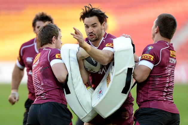 BRISBANE, AUSTRALIA - JULY 08: David Guerra charges into the pads during a Queensland Maroons State of Origin captain's run at Suncorp Stadium on July 8, 2014 in Brisbane, Australia. (Photo by Bradley Kanaris/Getty Images) BRISBANE, AUSTRALIA - JULY 08: David Guerra charges into the pads during a Queensland Maroons State of Origin captain's run at Suncorp Stadium on July 8, 2014 in Brisbane, Australia. (Photo by Bradley Kanaris/Getty Images)