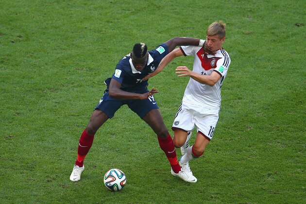 RIO DE JANEIRO, BRAZIL - JULY 04:  Paul Pogba of France fights off Toni Kroos of Germany during the 2014 FIFA World Cup Brazil Quarter Final match between France and Germany at Maracana on July 4, 2014 in Rio de Janeiro, Brazil.  (Photo by Clive Rose/Getty Images)