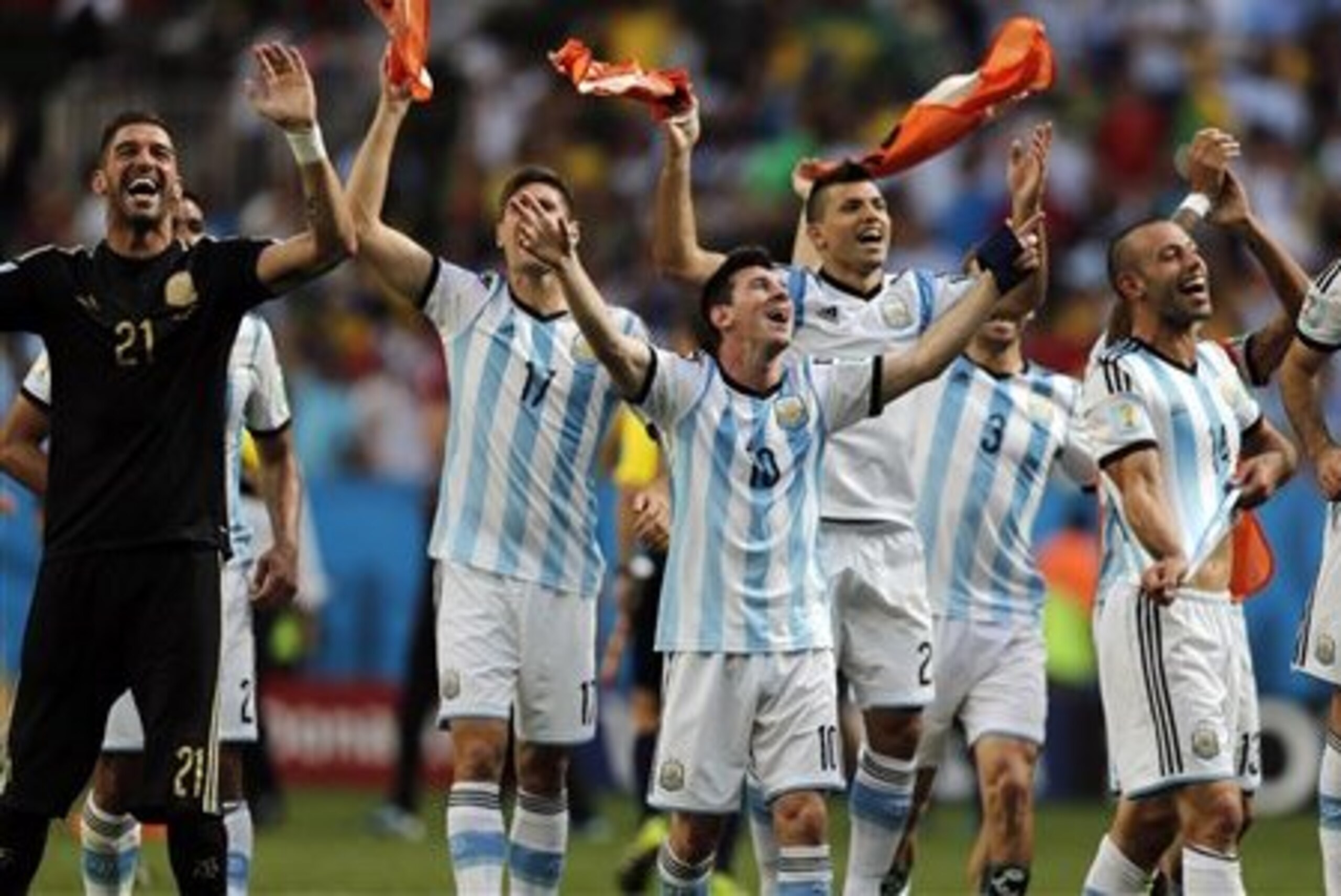CORRECTS PHOTOGRAPHER'S BYLINE - Argentina's Lionel Messi and teammates celebrate at the end of the World Cup quarterfinal soccer match between Argentina and Belgium at the Estadio Nacional in Brasilia, Brazil, Saturday, July 5, 2014. Argentina won 1-0. (AP Photo/Eraldo Peres)