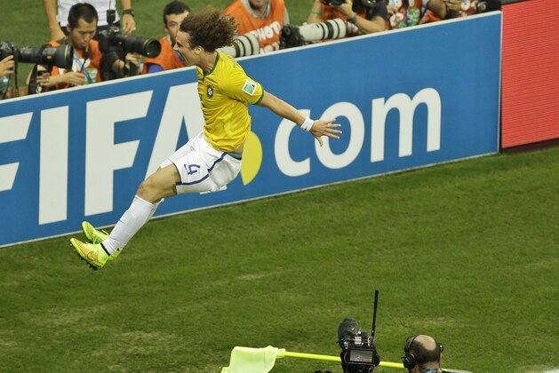 Brazil's David Luiz celebrates after scoring his side's second goal during the World Cup quarterfinal soccer match between Brazil and Colombia at the Arena Castelao in Fortaleza, Brazil, Friday, July 4, 2014. (AP Photo/Themba Hadebe)