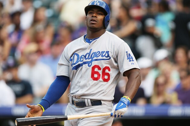 Los Angeles Dodgers' Yasiel Puig reacts after missing a pitch in the fifth inning of a baseball game against the Colorado Rockies in Denver, Thursday, July 3, 2014. (AP Photo/David Zalubowski) Los Angeles Dodgers' Yasiel Puig reacts after missing a pitch in the fifth inning of a baseball game against the Colorado Rockies in Denver, Thursday, July 3, 2014. (AP Photo/David Zalubowski)