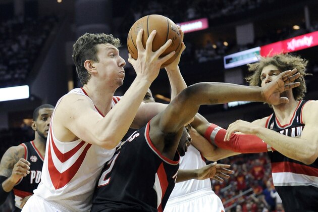 Houston Rockets' Omer Asik, left, shoots over Portland Trail Blazers' Wesley Matthews (2) as Robin Lopez, right, stands near in the second half of Game 5 of an opening-round NBA basketball playoff series Wednesday, April 30, 2014, in Houston. The Rockets won 108-98 to send the teams back to Portland for Game 6. (AP Photo/Pat Sullivan) Houston Rockets' Omer Asik, left, shoots over Portland Trail Blazers' Wesley Matthews (2) as Robin Lopez, right, stands near in the second half of Game 5 of an opening-round NBA basketball playoff series Wednesday, April 30, 2014, in Houston. The Rockets won 108-98 to send the teams back to Portland for Game 6. (AP Photo/Pat Sullivan)
