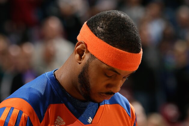 SACRAMENTO, CA - MARCH 26:  Carmelo Anthony #7 of the New York Knicks stands for the National Anthem before their game against the Sacramento Kings at Sleep Train Arena on March 26, 2014 in Sacramento, California. NOTE TO USER: User expressly acknowledges and agrees that, by downloading and or using this photograph, User is consenting to the terms and conditions of the Getty Images License Agreement.  (Photo by Ezra Shaw/Getty Images)
