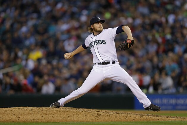 Seattle Mariners pitcher Brandon Maurer throws in the eighth inning of a baseball game against the Cleveland Indians, Saturday, June 28, 2014, in Seattle. The Indians defeated the Mariners 5-0. (AP Photo/Ted S. Warren)