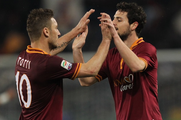 ROME, ITALY - MARCH 25:  Mattia Destro (R) with his teammate Francesco Totti of AS Roma celebrates after scoring the opening goal during the Serie A match between AS Roma and Torino FC at Stadio Olimpico on March 25, 2014 in Rome, Italy.  (Photo by Paolo Bruno/Getty Images)