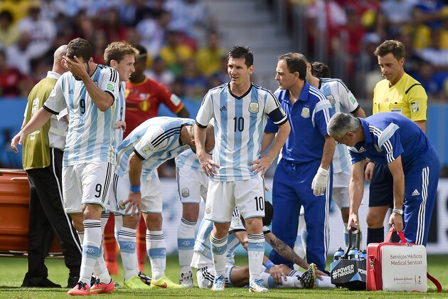 Argentina's Gonzalo Higuain, left, and Lionel Messi react after Angel di Maria was injured during the World Cup quarterfinal soccer match between Argentina and Belgium at the Estadio Nacional in Brasilia, Brazil, Saturday, July 5, 2014. (AP Photo/Martin Meissner)