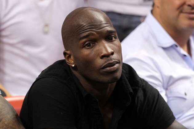 MIAMI, FL - MAY 24:  Chad 'Ochocinco' Johnson watches the Miami Heat play against the Chicago Bulls in Game Four of the Eastern Conference Finals during the 2011 NBA Playoffs on May 24, 2011 at American Airlines Arena in Miami, Florida. NOTE TO USER: User expressly acknowledges and agrees that, by downloading and or using this photograph, User is consenting to the terms and conditions of the Getty Images License Agreement.  (Photo by Mike Ehrmann/Getty Images)