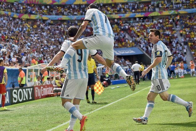Argentina's Gonzalo Higuain, left, celebrates with Angel di Maria, center, and Lionel Messi after he scored the opening goal during the World Cup quarterfinal soccer match between Argentina and Belgium at the Estadio Nacional in Brasilia, Brazil, Saturday, July 5, 2014. (AP Photo/Martin Meissner) Argentina's Gonzalo Higuain, left, celebrates with Angel di Maria, center, and Lionel Messi after he scored the opening goal during the World Cup quarterfinal soccer match between Argentina and Belgium at the Estadio Nacional in Brasilia, Brazil, Saturday, July 5, 2014. (AP Photo/Martin Meissner)