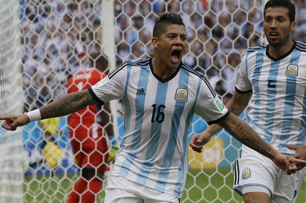 Argentina's Marcos Rojo celebrates scoring his side's third goal during the group F World Cup soccer match between Nigeria and Argentina at the Estadio Beira-Rio in Porto Alegre, Brazil, Wednesday, June 25, 2014. (AP Photo/Fernando Vergara)
