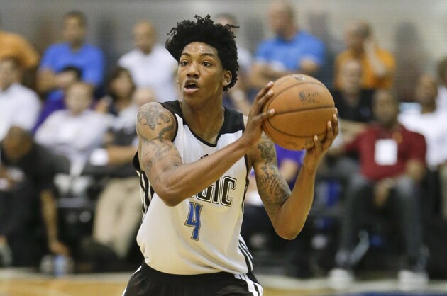 Orlando Magic's Elfrid Payton looks to pass the ball against the Houston Rockets during an NBA summer league basketball game in Orlando, Fla., Monday, July 7, 2014. (AP Photo/John Raoux)
