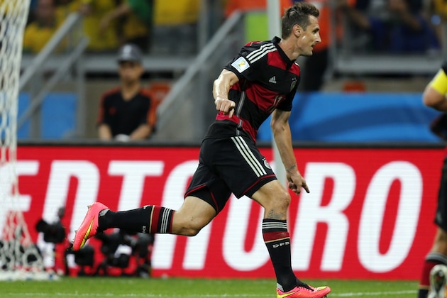 Germany's Miroslav Klose celebrates after scoring his side's second goal during the World Cup semifinal soccer match between Brazil and Germany at the Mineirao Stadium in Belo Horizonte, Brazil, Tuesday, July 8, 2014. (AP Photo/Frank Augstein)