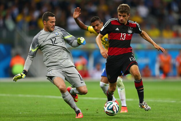 BELO HORIZONTE, BRAZIL - JULY 08:  Goalkeeper Julio Cesar of Brazil tries to make a save on Thomas Mueller of Germany  during the 2014 FIFA World Cup Brazil Semi Final match between Brazil and Germany at Estadio Mineirao on July 8, 2014 in Belo Horizonte, Brazil.  (Photo by Michael Steele/Getty Images)