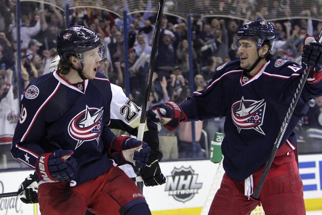 Columbus Blue Jackets' Ryan Johansen, left, celebrates his goal against the Pittsburgh Penguins with teammate Artem Anisimov, of Russia, during the second period of Game 4 of a first-round NHL hockey playoff series on Wednesday, April 23, 2014, in Columbus, Ohio. (AP Photo/Jay LaPrete)