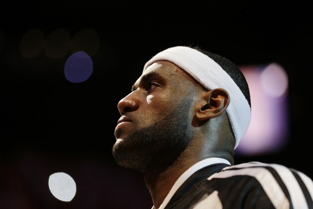 Miami Heat forward LeBron James during the pre-game ceremony in Game 4 of the NBA basketball finals against the San Antonio Spurs, Thursday, June 12, 2014, in Miami.  (AP Photo/Lynne Sladky)