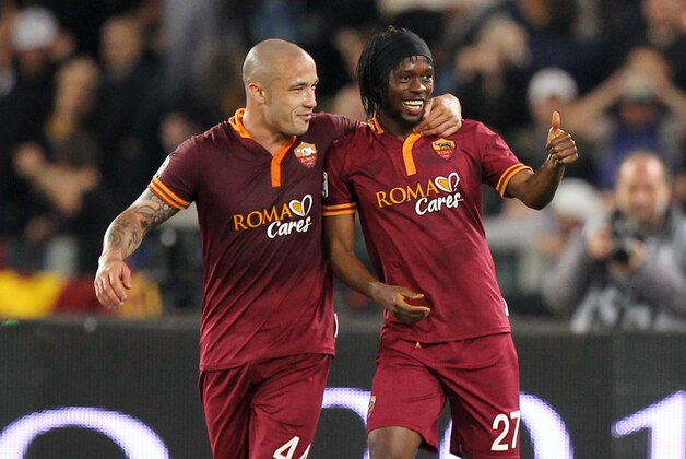 ROME, ITALY - APRIL 25: Gervinho (R) with his teammate Radja Nainggolan celebrates after scoring the second team's goal during the Serie A match between AS Roma and AC Milan at Stadio Olimpico on April 25, 2014 in Rome, Italy. (Photo by Paolo Bruno/Getty Images) ROME, ITALY - APRIL 25: Gervinho (R) with his teammate Radja Nainggolan celebrates after scoring the second team's goal during the Serie A match between AS Roma and AC Milan at Stadio Olimpico on April 25, 2014 in Rome, Italy. (Photo by Paolo Bruno/Getty Images)
