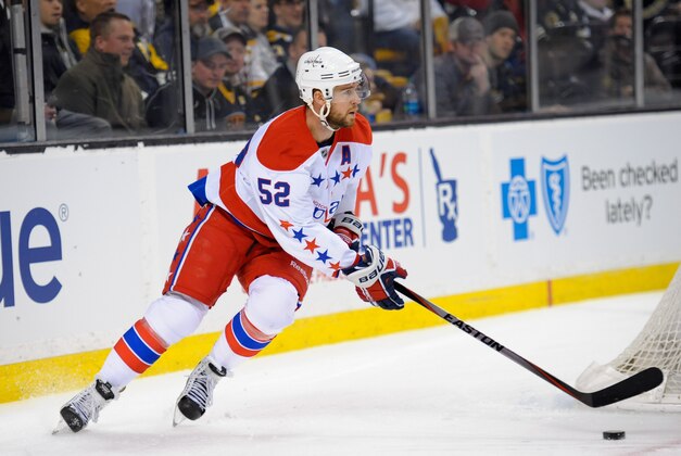 Mar 1, 2014; Boston, MA, USA; Washington Capitals defenseman Mike Green (52) skates with the puck during the first period against the Boston Bruins at TD Banknorth Garden. Mandatory Credit: Bob DeChiara-USA TODAY Sports