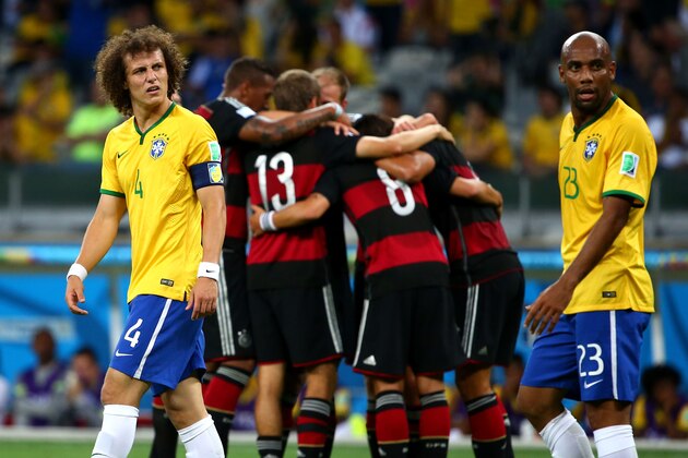 BELO HORIZONTE, BRAZIL - JULY 08:  David Luiz and Maicon of Brazil look dejected after allowing Germany's fifth goal during the 2014 FIFA World Cup Brazil Semi Final match between Brazil and Germany at Estadio Mineirao on July 8, 2014 in Belo Horizonte, Brazil.  (Photo by Robert Cianflone/Getty Images)