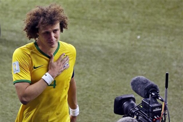 Brazil's David Luiz leaves the pitch after the World Cup semifinal soccer match between Brazil and Germany at the Mineirao Stadium in Belo Horizonte, Brazil, Tuesday, July 8, 2014. Germany won 7-1.(AP Photo/Themba Hadebe)