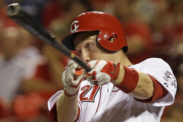Cincinnati Reds' Todd Frazier gets a hit off Chicago Cubs starting pitcher Edwin Jackson to drive in a run in the fifth inning of a baseball game, Monday, July 7, 2014, in Cincinnati. (AP Photo/Al Behrman)