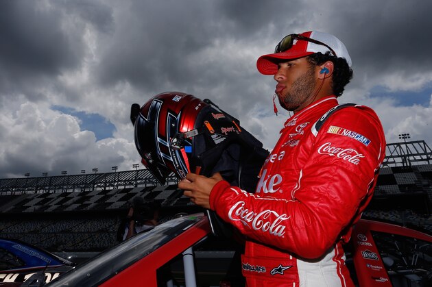 DAYTONA BEACH, FL - JULY 04: Darrell Wallace Jr., driver of the #20 Share a Coke Toyota, stands on the grid during qualifying for the NASCAR Nationwide Series Subway Firecracker 250 at Daytona International Speedway on July 4, 2014 in Daytona Beach, Florida.  (Photo by Chris Trotman/Getty Images)