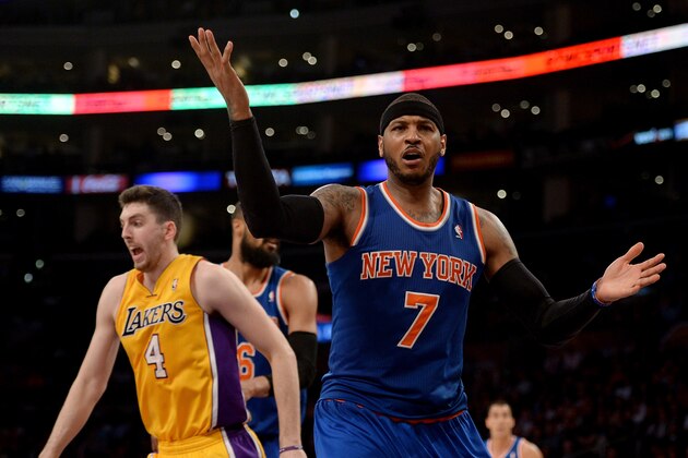 LOS ANGELES, CA - MARCH 25: Carmelo Anthony #7 of the New York Knicks reacts for a foul in front of Ryan Kelly #4 of the Los Angeles Lakers during the game at Staples Center on March 25, 2014 in Los Angeles, California. NOTE TO USER: User expressly acknowledges and agrees that, by downloading and or using this Photograph, user is consenting to the terms and condition of the Getty Images License Agreement. (Photo by Harry How/Getty Images) LOS ANGELES, CA - MARCH 25: Carmelo Anthony #7 of the New York Knicks reacts for a foul in front of Ryan Kelly #4 of the Los Angeles Lakers during the game at Staples Center on March 25, 2014 in Los Angeles, California. NOTE TO USER: User expressly acknowledges and agrees that, by downloading and or using this Photograph, user is consenting to the terms and condition of the Getty Images License Agreement. (Photo by Harry How/Getty Images)