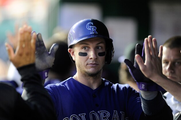 WASHINGTON, DC - JUNE 30:  Troy Tulowitzki #2 of the Colorado Rockies celebrates with teammates after scoring in the sixth inning against the Washington Nationals at Nationals Park on June 30, 2014 in Washington, DC.  (Photo by Greg Fiume/Getty Images)