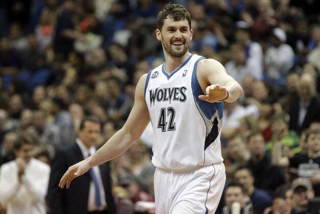 Minnesota Timberwolves' Kevin Love , left, congratulates Corey Brewer after Brewer's dunk in the first quarter of an NBA basketball game against the Detroit Pistons, Friday, March 7, 2014, in Minneapolis. (AP Photo/Jim Mone) Minnesota Timberwolves' Kevin Love , left, congratulates Corey Brewer after Brewer's dunk in the first quarter of an NBA basketball game against the Detroit Pistons, Friday, March 7, 2014, in Minneapolis. (AP Photo/Jim Mone)