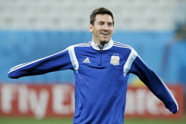 Argentina's Lionel Messi warms up during a training session one day before their World Cup semifinal soccer match between Netherlands and Argentina at Itaquerao Stadium in Sao Paulo, Brazil, Tuesday, July 8, 2014. (AP Photo/Victor R. Caivano)