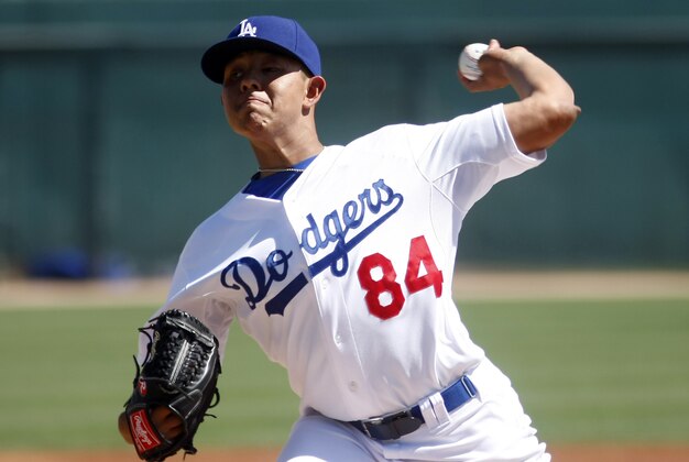 Mar 15, 2014; Phoenix, AZ, USA; Los Angeles Dodgers pitcher Julio Urias (84) throws in the first inning against the San Diego Padres at Camelback Ranch. Mandatory Credit: Rick Scuteri-USA TODAY Sports Mar 15, 2014; Phoenix, AZ, USA; Los Angeles Dodgers pitcher Julio Urias (84) throws in the first inning against the San Diego Padres at Camelback Ranch. Mandatory Credit: Rick Scuteri-USA TODAY Sports
