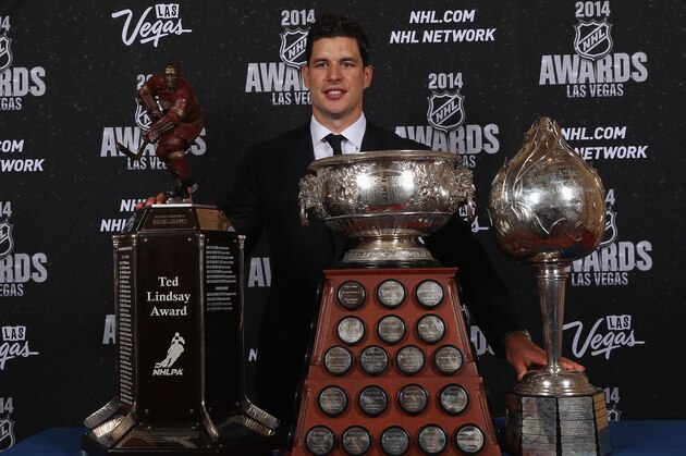 LAS VEGAS, NV - JUNE 24:  Sidney Crosby of the Pittsburgh Penguins poses with the Ted Lindsay Award, the Hart Memorial Trophy, and the Art Ross Trophy during the 2014 NHL Awards at the Encore Theater at Wynn Las Vegas on June 24, 2014 in Las Vegas, Nevada.  (Photo by Bruce Bennett/Getty Images)