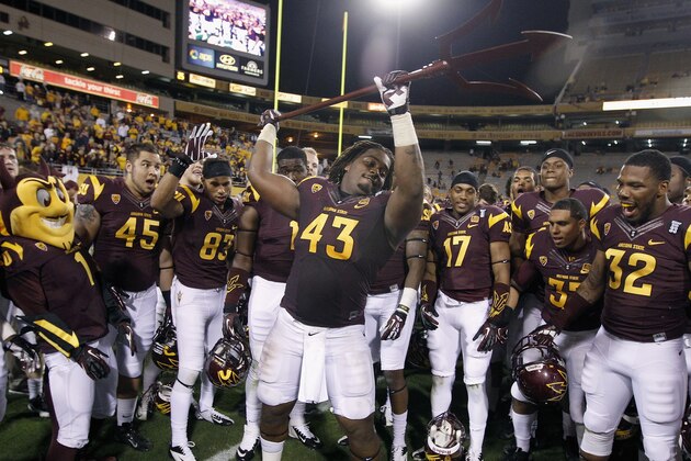 TEMPE, AZ - NOVEMBER 16:  Davon Coleman #43 of the Arizona State Sun Devils drives a pitchfork into the turf in celebration of their 30-17 victory over the Oregon State Beavers during their college football game at Sun Devil Stadium on November 16, 2013 in Tempe, Arizona.  (Photo by Ralph Freso/Getty Images)