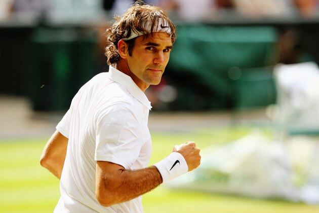 LONDON, ENGLAND - JULY 06:  Roger Federer of Switzerland celebrates winning the fourth set to even the score at two sets each during the Gentlemen's Singles Final match against Novak Djokovic of Serbia on day thirteen of the Wimbledon Lawn Tennis Championships at the All England Lawn Tennis and Croquet Club on July 6, 2014 in London, England.  (Photo by Al Bello/Getty Images)