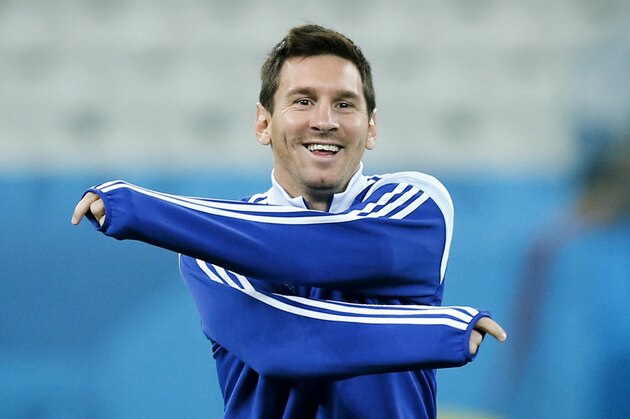 Argentina's Lionel Messi warms up during a training session one day before their World Cup semifinal soccer match between Netherlands and Argentina at Itaquerao Stadium in Sao Paulo, Brazil, Tuesday, July 8, 2014. (AP Photo/Victor R. Caivano)