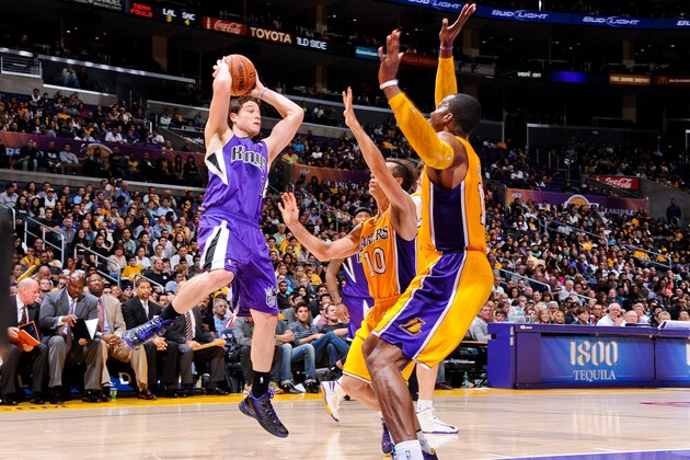 LOS ANGELES, CA - OCTOBER 21: Jimmer Fredette #7 of the Sacramento Kings looks to pass the ball against Steve Nash #10 of the Los Angeles Lakers during a pre-season game at Staples Center on October 21, 2012 in Los Angeles, California. NOTE TO USER: User expressly acknowledges and agrees that, by downloading and/or using this photograph, user is consenting to the terms and conditions of the Getty Images License Agreement. Mandatory Copyright Notice: Copyright 2012 NBAE (Photo by Andrew D. Bernstein/NBAE via Getty Images)