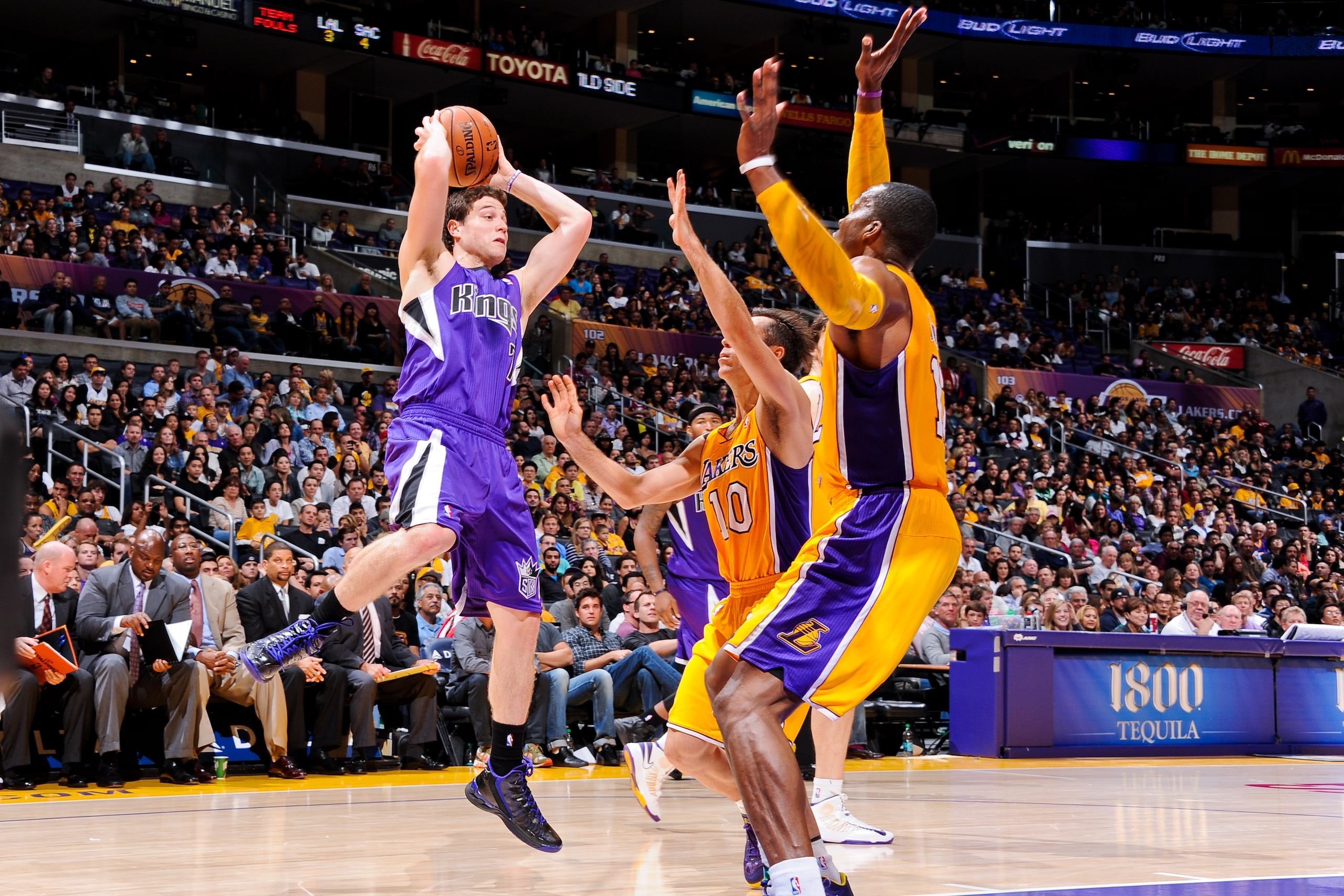 LOS ANGELES, CA - OCTOBER 21: Jimmer Fredette #7 of the Sacramento Kings looks to pass the ball against Steve Nash #10 of the Los Angeles Lakers during a pre-season game at Staples Center on October 21, 2012 in Los Angeles, California. NOTE TO USER: User expressly acknowledges and agrees that, by downloading and/or using this photograph, user is consenting to the terms and conditions of the Getty Images License Agreement. Mandatory Copyright Notice: Copyright 2012 NBAE (Photo by Andrew D. Bernstein/NBAE via Getty Images)