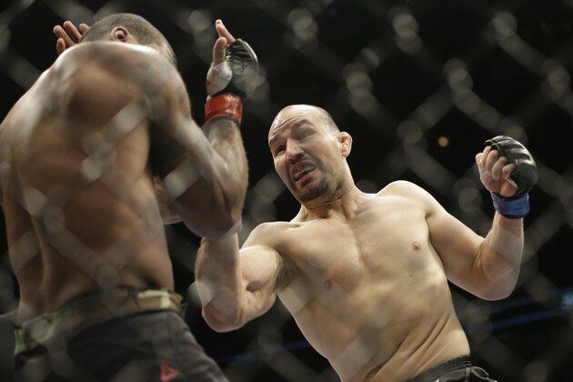 Glover Teixeira, right, fights Quinton Jackson during UFC Light Heavyweight Championship on FOX 6 at the United Center in Chicago, Saturday, Jan. 26, 2013. Teixeira won the bout. (AP Photo/Nam Y. Huh)