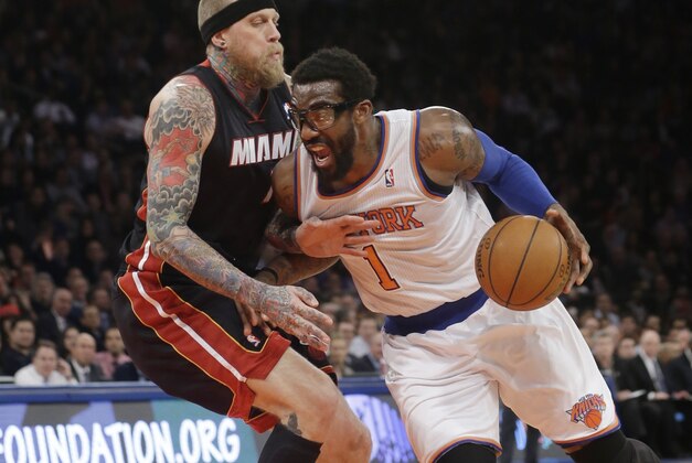 Miami Heat's Chris Andersen, left, defends New York Knicks' Amare Stoudemire (1) during the first half of an NBA basketball game on Thursday, Jan. 9, 2014, in New York. (AP Photo/Frank Franklin II)
