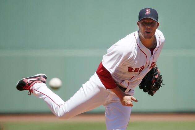 Boston Red Sox's Jake Peavy pitches in the first inning of a baseball game against the Baltimore Orioles in Boston, Sunday, July 6, 2014. (AP Photo/Michael Dwyer)