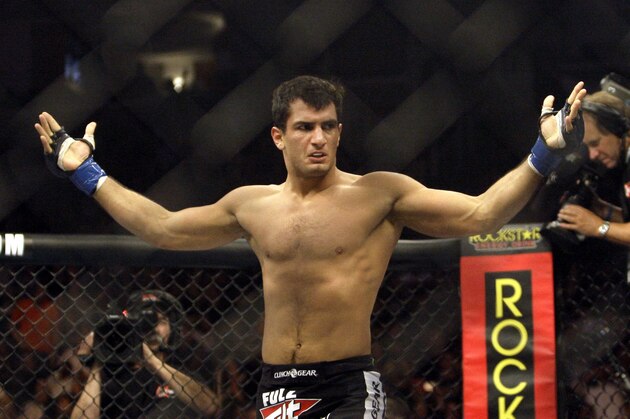Gegard Mousasi celebrates after beating Renato Sobral in a Strikeforce mixed martial arts Light Heavyweight Championship match on Saturday, Aug. 15, 2009, in San Jose, Calif. Mousasi won by TKO in the first round to win the championship. (AP Photo/Jeff Chiu)